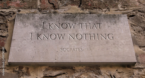 The phrase I know that I know nothing, sometimes called the Socratic paradox, is a saying that is derived from Plato's account of the Greek philosopher Socrates. Engraved text.