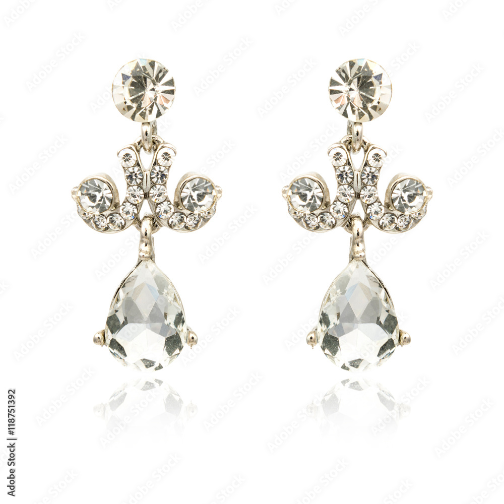 Pair of silver diamond earrings isolated on white Pair of silver diamond earrings isolated on white