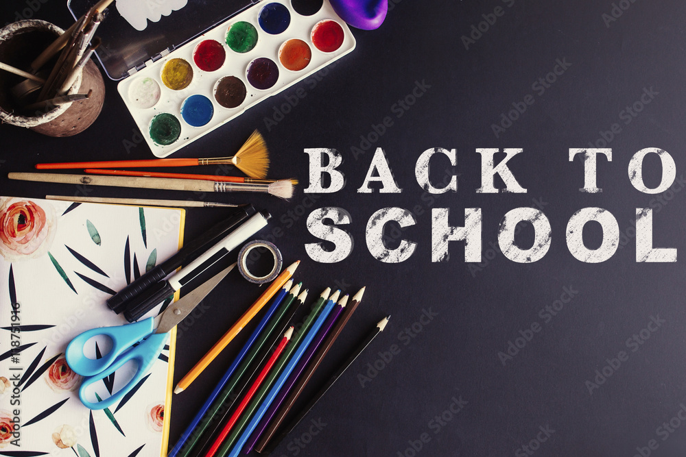 back to school concept text white chalk on black board, colorful