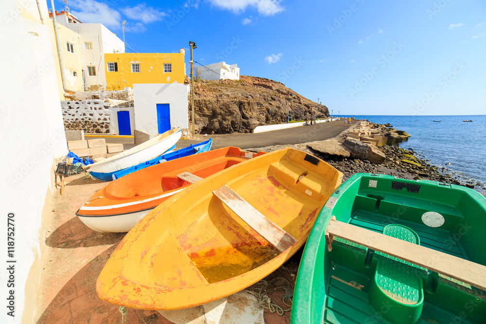 Wooden fishing boats in a small port in El Tarajalejo in Canary Islands - obrazy, fototapety, plakaty 