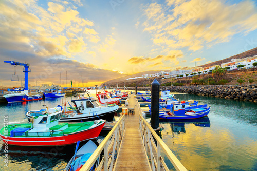 Sunset over a port in Gran Tarajal, Fuerteventura, Canary islands photo