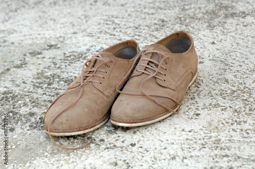 Male shoes on cement background