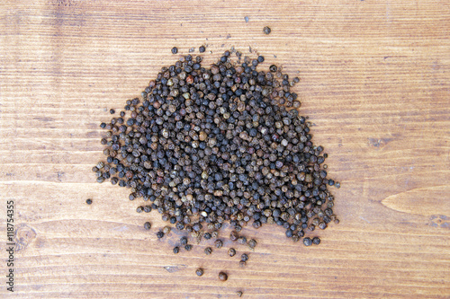 Fotografie Dried peppers on wooden table
