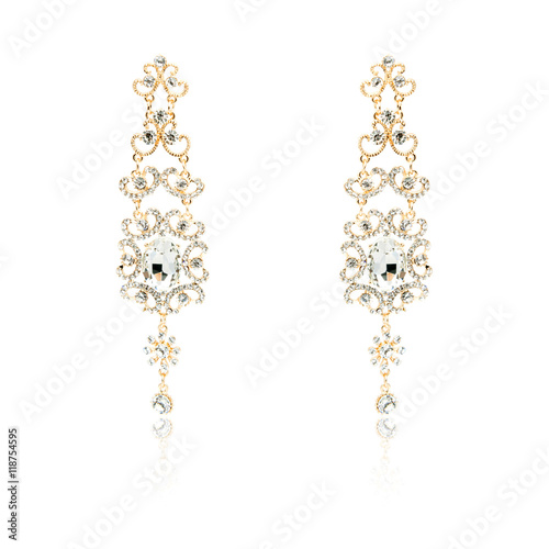 Pair of golden diamond earrings isolated on white