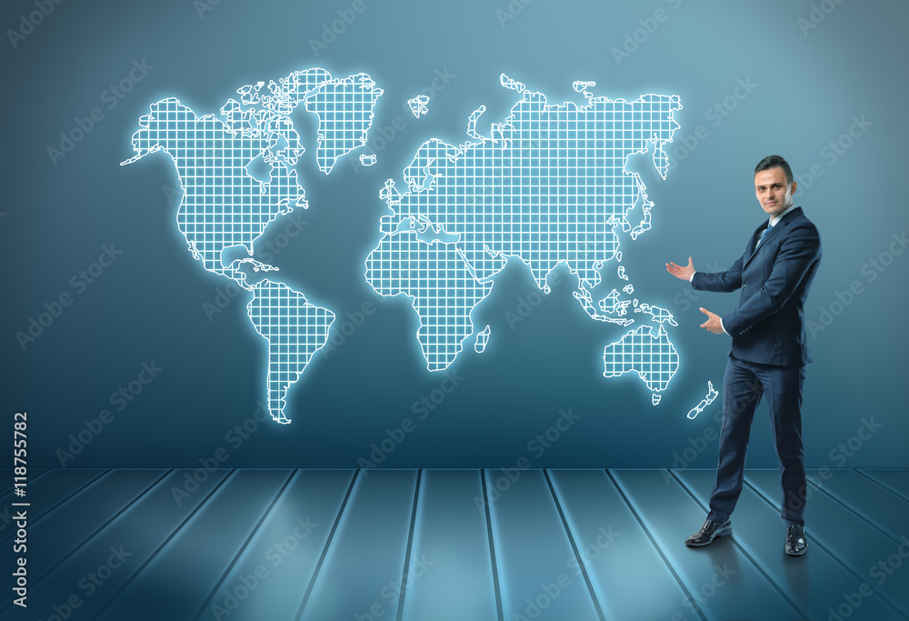 Businessman stands showing world map by both hands Businessman stands showing world map by both hands