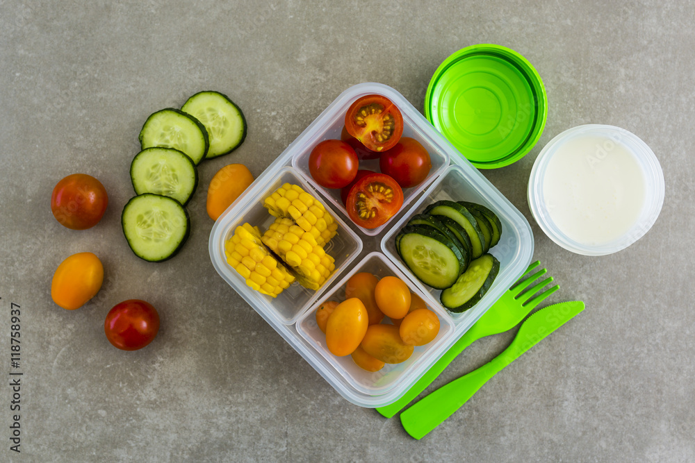 Healthy vegetarian food in plastic lunch box on light background.
Healthy vegetarian food in plastic lunch box on light background.