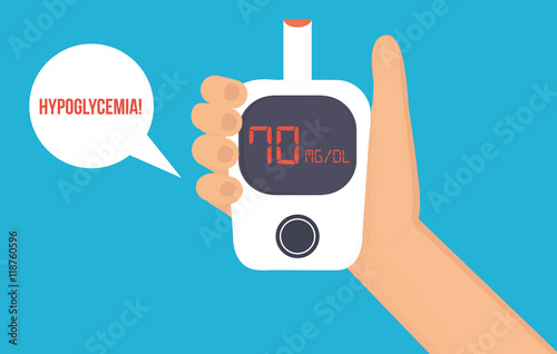 Hand with glucose meter shows low blood glucose level. Hypoglycemia concept.