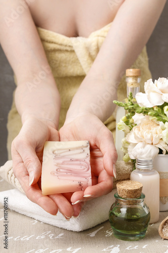 Woman holding bar of soap