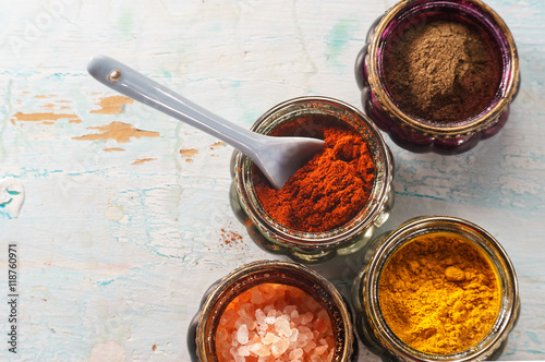 Fototapeta Naklejka Na Ścianę i Meble -  Colorful oriental spices on wooden table