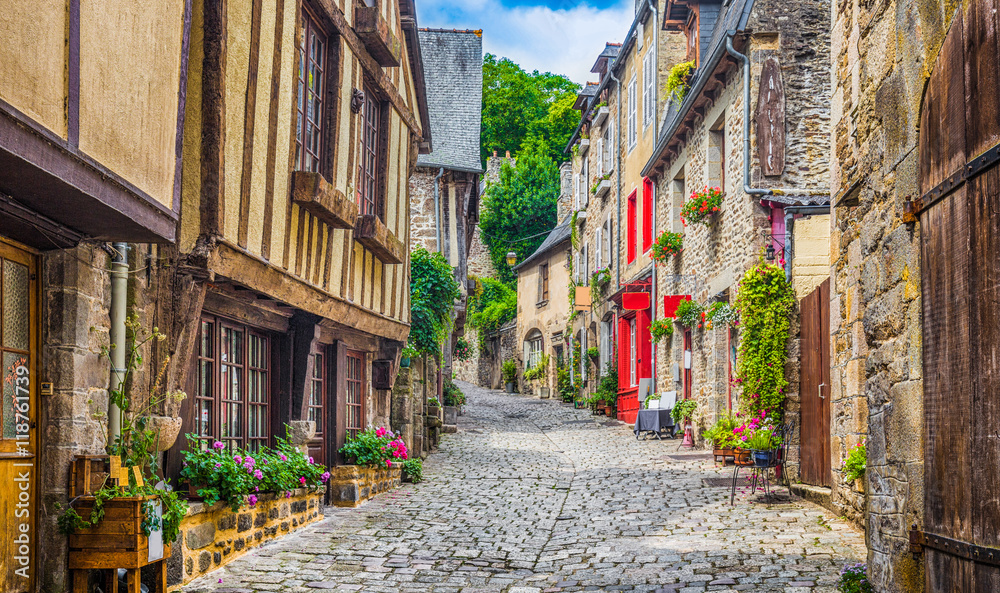 Fototapeta premium Traditional houses in narrow alley in an old town in Europe