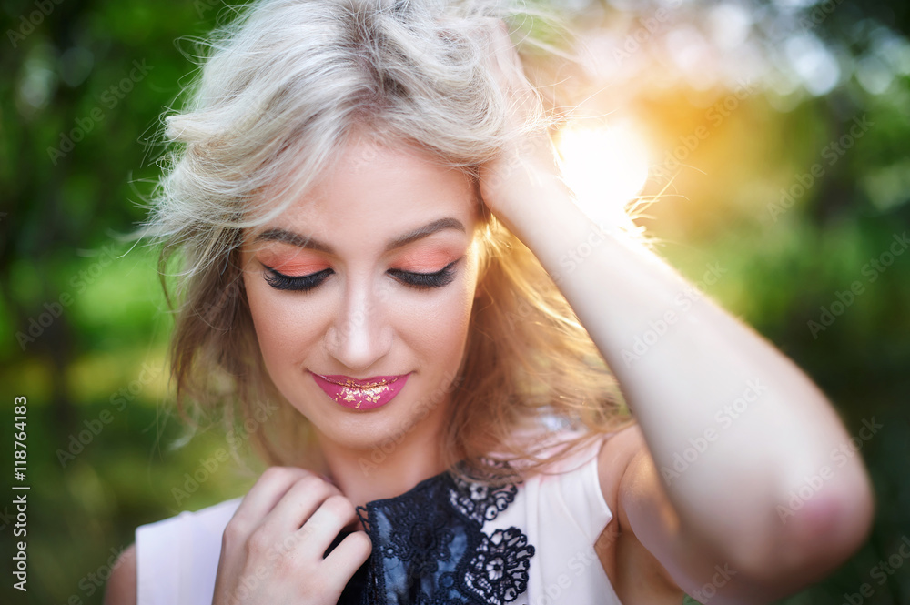 beautiful young woman posing in a summer park beautiful young woman posing in a summer park