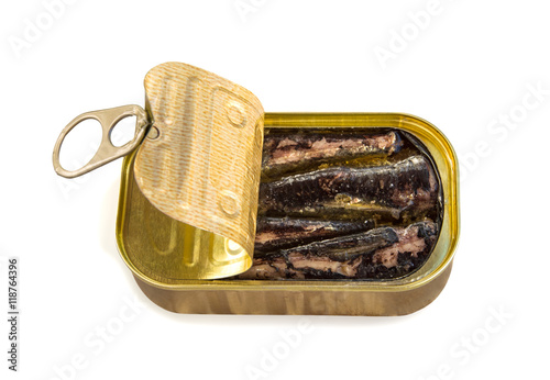 Open tin can with sardines isolated over white.