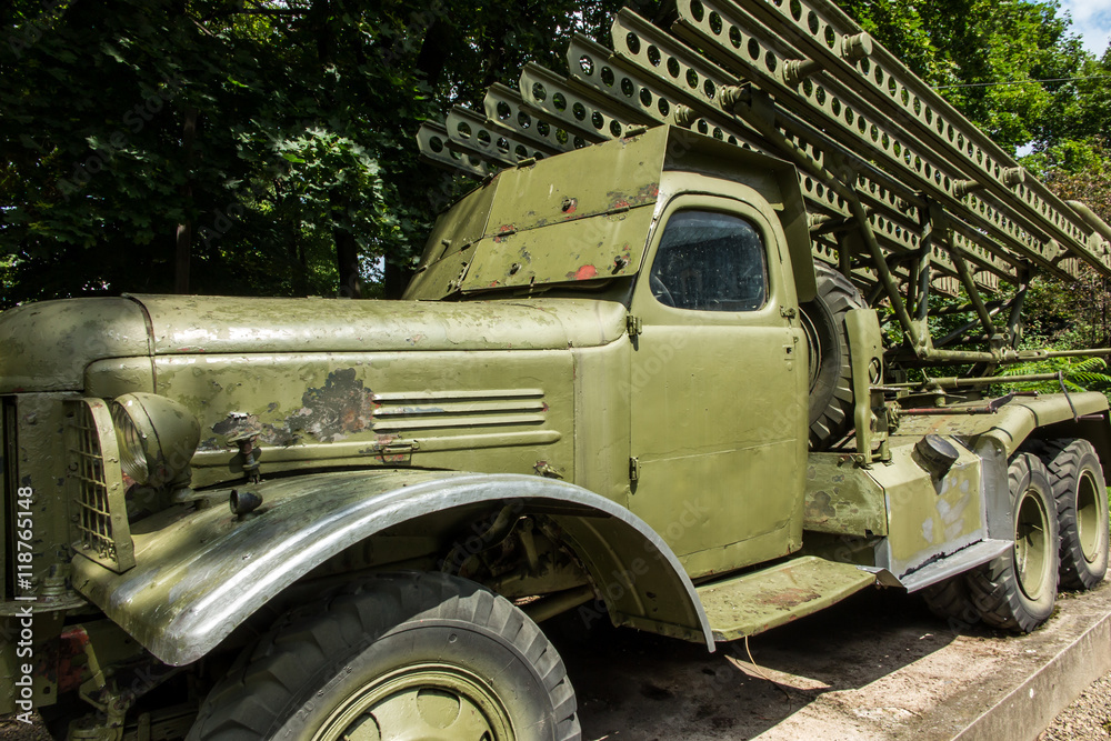 Old car adapted as a military rocket launcher standing on the square in front of the museum in Dukla 