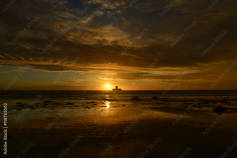 St.Ouen's Bay, Jersey, U.K.  Wide angle image of a dramatic coastal Summer sunset.