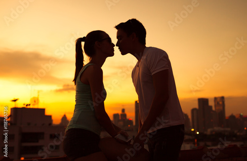 Young couple kissing in the city. 