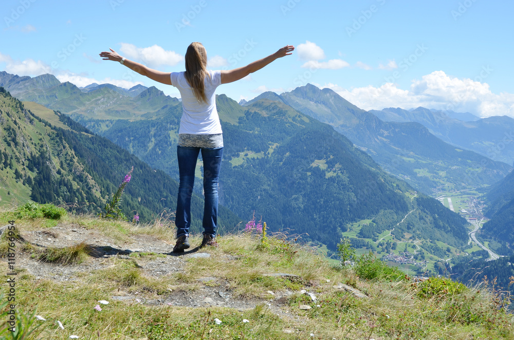 Girl enjoying Alpine scenery at Gotthard pass, Switzerland Girl enjoying Alpine scenery at Gotthard pass, Switzerland