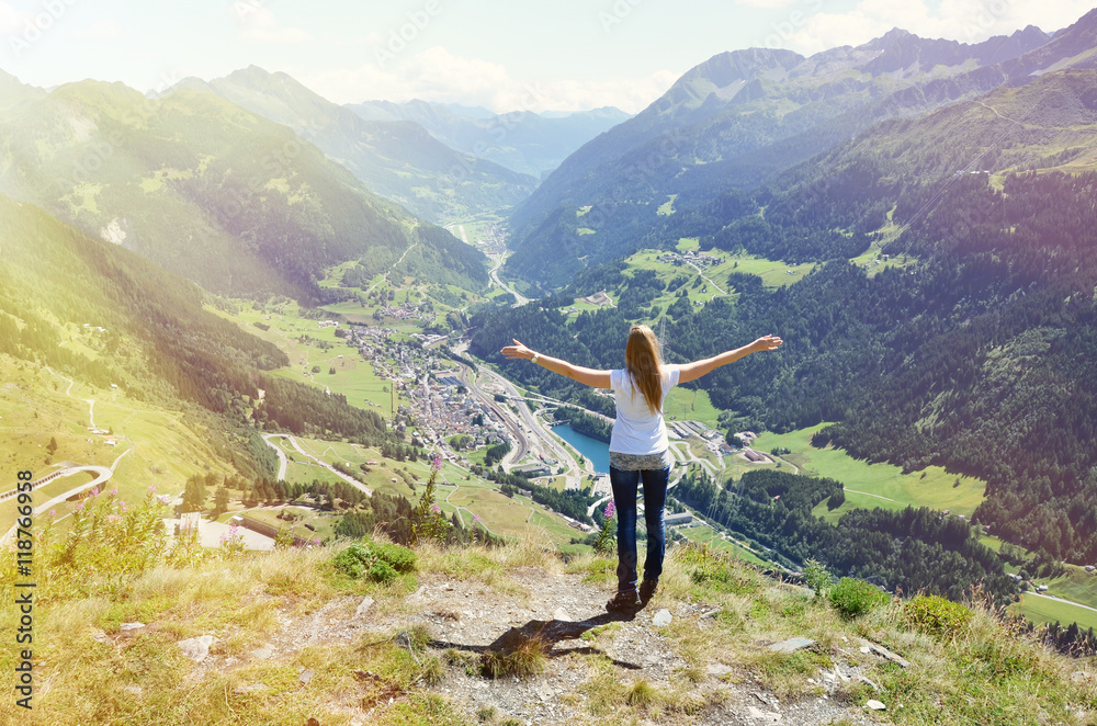 Girl enjoying Alpine scenery at Gotthard pass, Switzerland