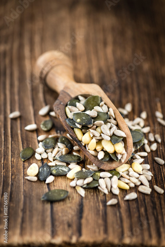 Mixed Seeds on wooden background (selective focus)