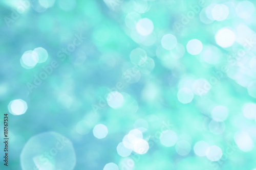 Abstract turquoise background with white bokeh