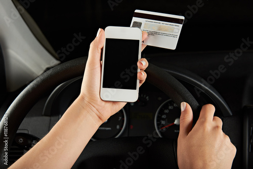 woman driver hold smartphone