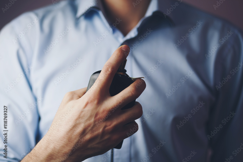 businessman using perfume businessman using perfume