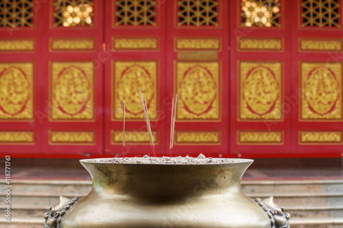 Joss stick with red wall background