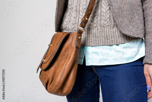 Attractive young woman with handbag