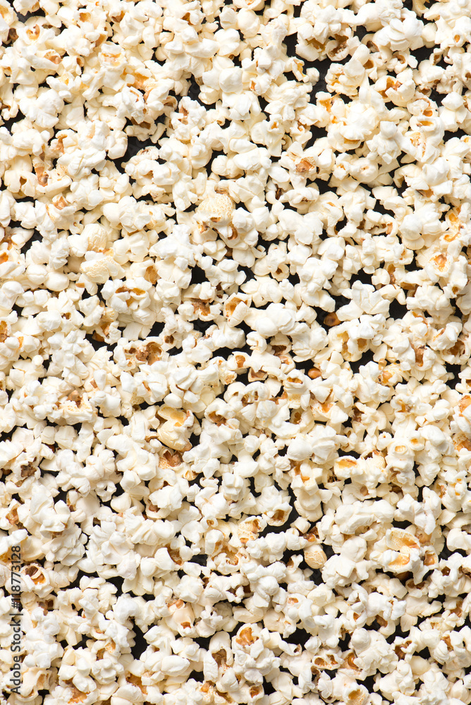 full frame of popcorn as a background, isolated on a black, top view full frame of popcorn as a background, isolated on a black, top view