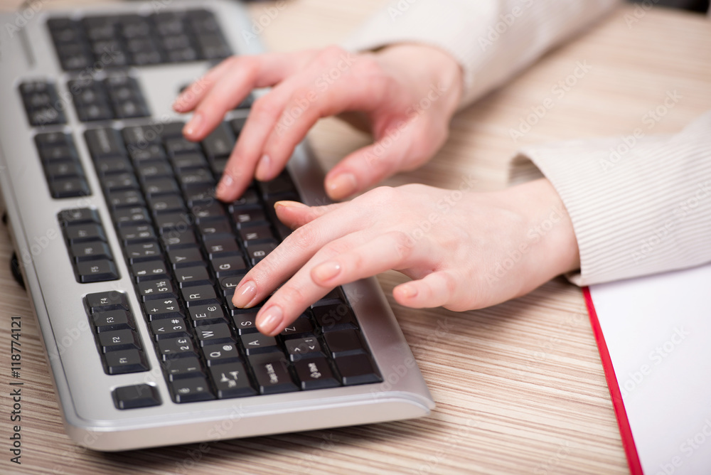 Hands working on the keyboard in the office Hands working on the keyboard in the office