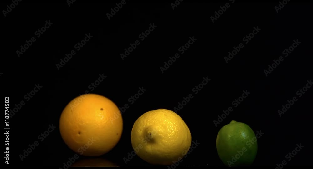 Fruits in slow motion on a black background Fruits in slow motion on a black background