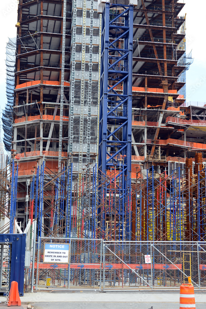 Construction site of new commercial building with skeleton buildings with steel girders and cement frame