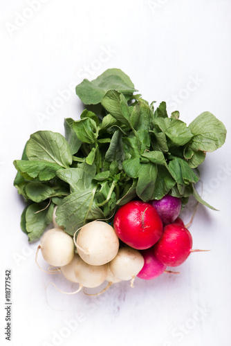 bunch of organically grown, freshly harvested, colorful Easter egg radishes, isolated over white board, close up