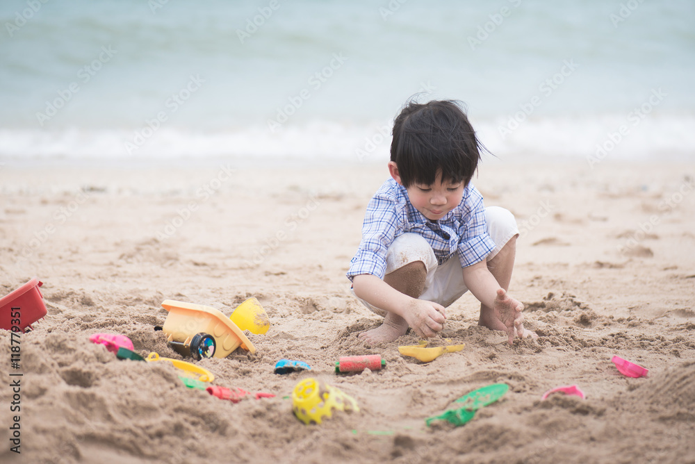 asian boy playing on the beach asian boy playing on the beach