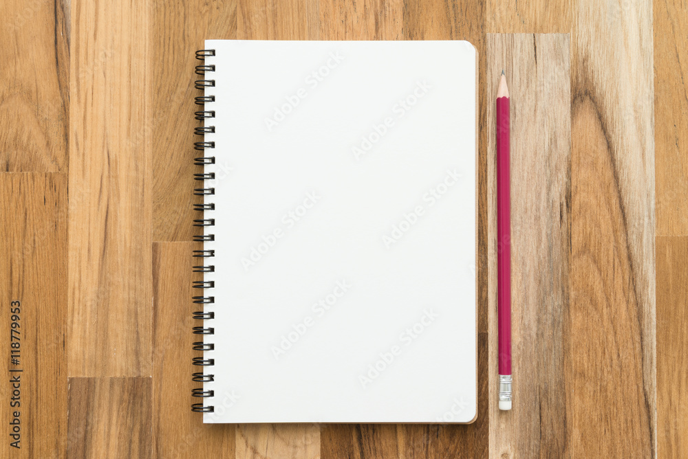 Blank empty notepad and pencil on wooden table background - Business and education concept. Blank empty notepad and pencil on wooden table background - Business and education concept.