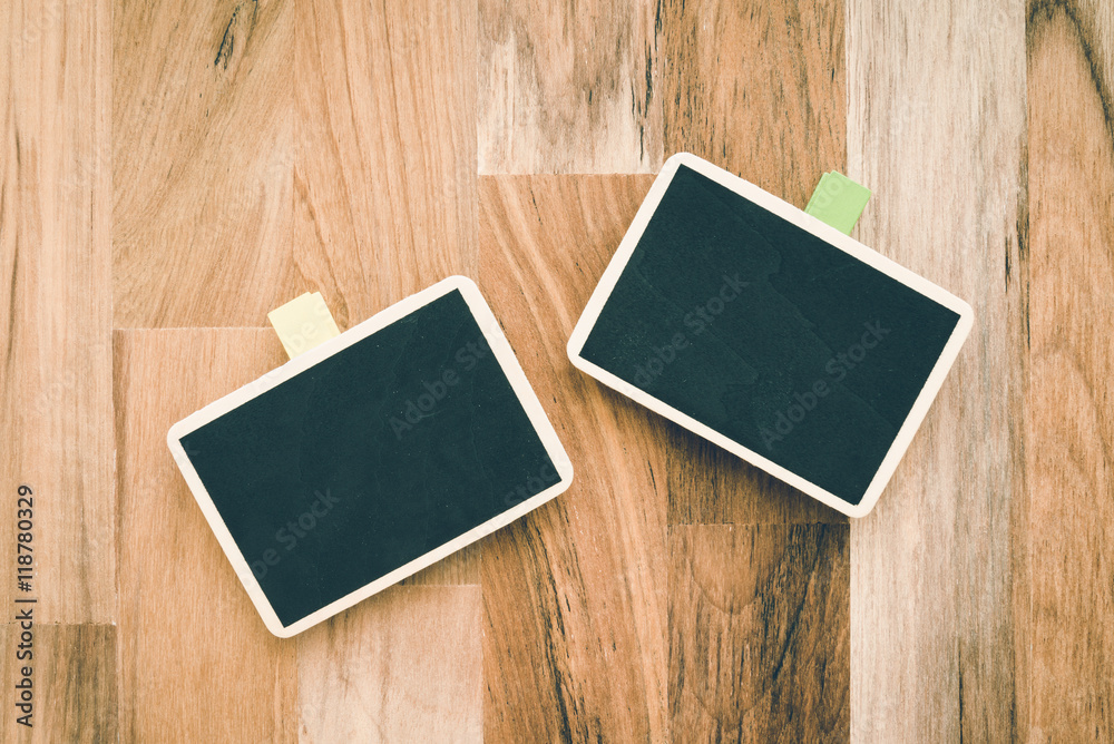 Small blackboard on wooden table background - Creative idea concept Small blackboard on wooden table background - Creative idea concept