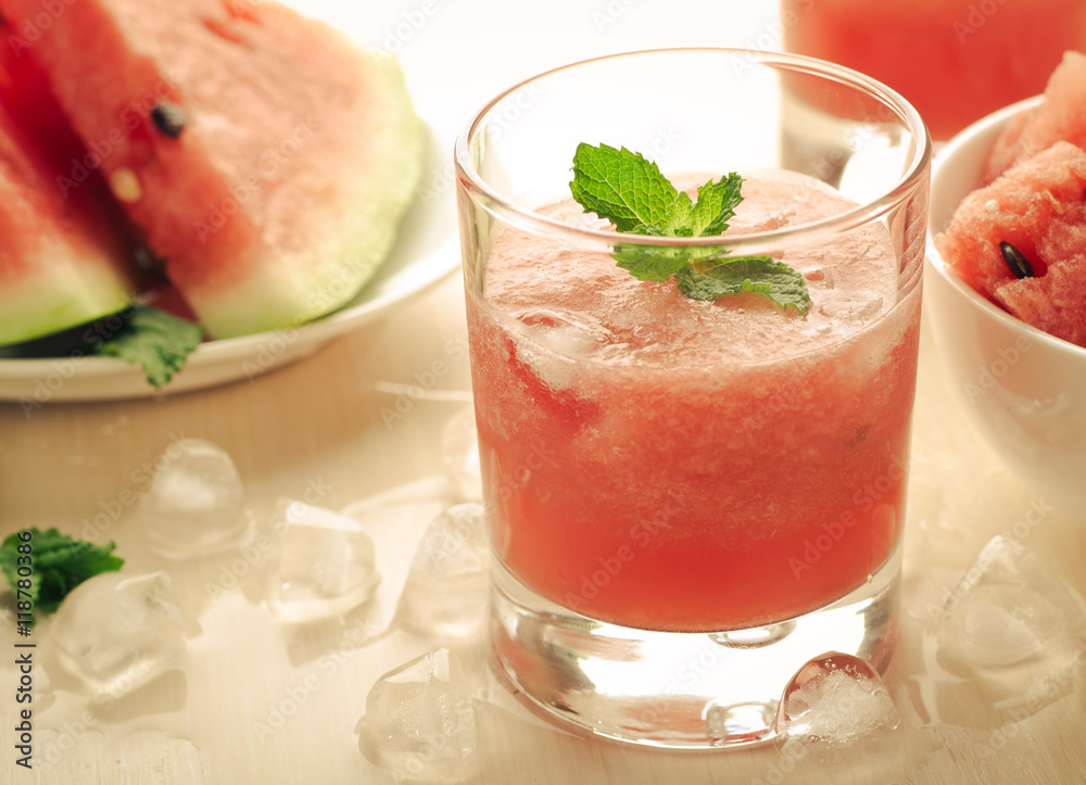 Healthy watermelon smoothie with mint and ice in glass Healthy watermelon smoothie with mint and ice in glass