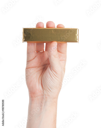 Hand holds tasty chocolate. Isolated on a white background.