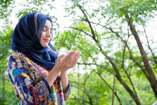 Photography Shot of muslim woman standing , praying portrait.