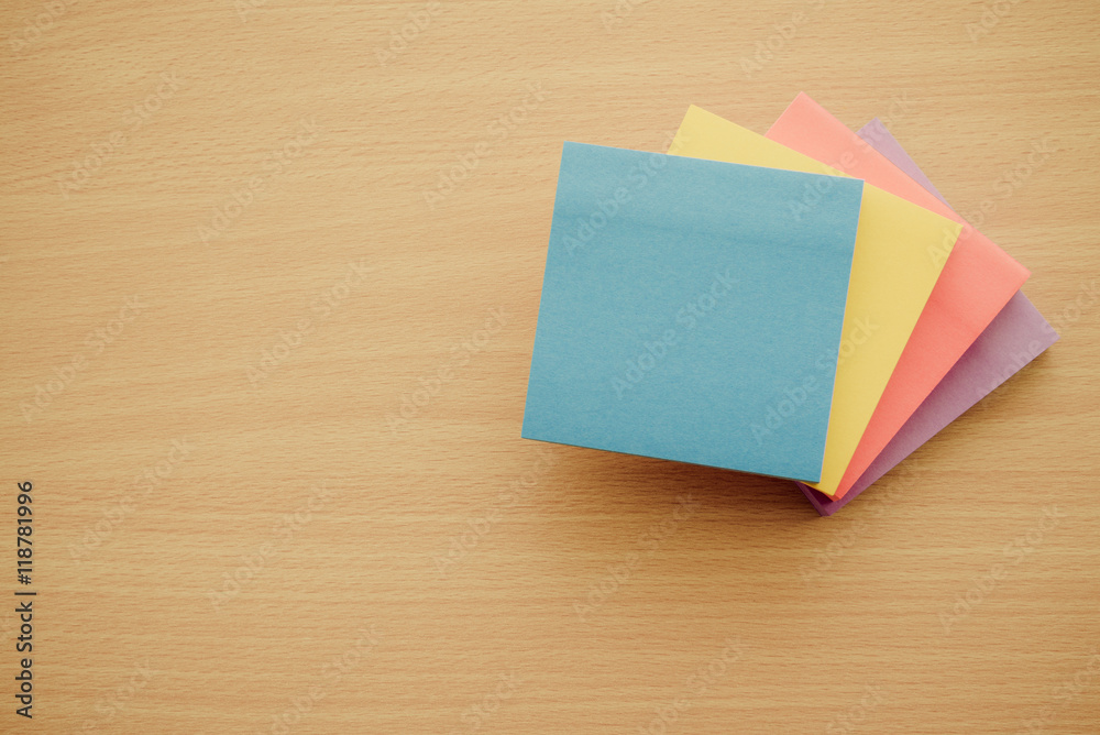 Color block of paper notes on wooden background Color block of paper notes on wooden background