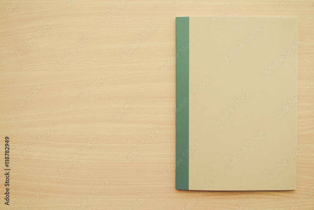 Blank empty notepad on wooden table background - Business and education concept.