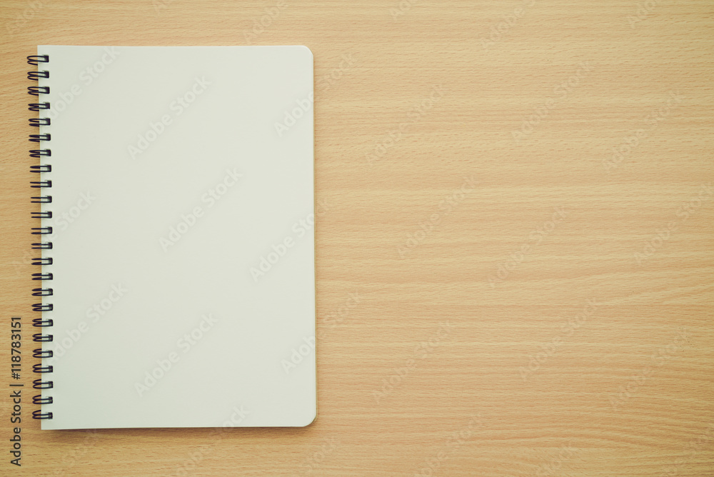 Blank empty notepad on wooden table background - Business and education concept. Blank empty notepad on wooden table background - Business and education concept.