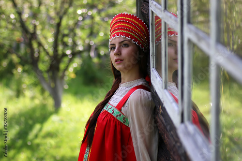 Slav woman in traditional dress wooden wall