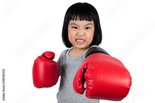 Asian Little Chinese Girl Wearing Boxing Glove With Fierce Expre © Tan Kian Khoon