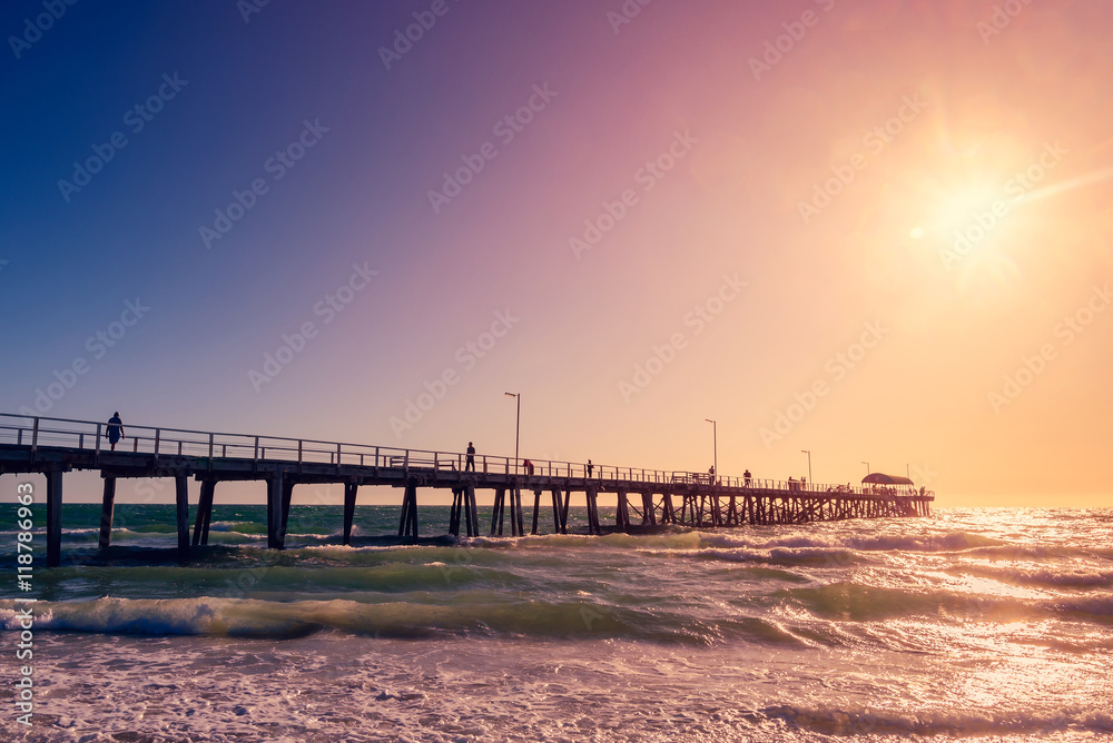 Henley Beach Jetty with people at sunset