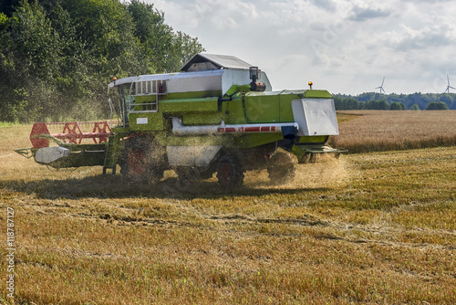 Working Harvesting Combine in the Field of Wheat