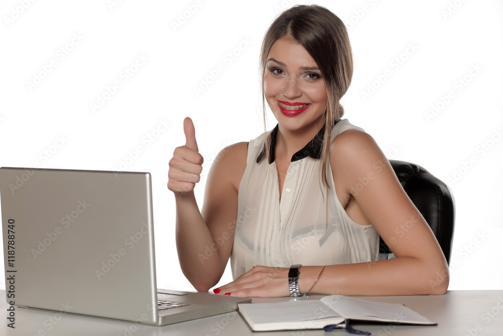 beautiful woman with laptop showing thumbs up beautiful woman with laptop showing thumbs up