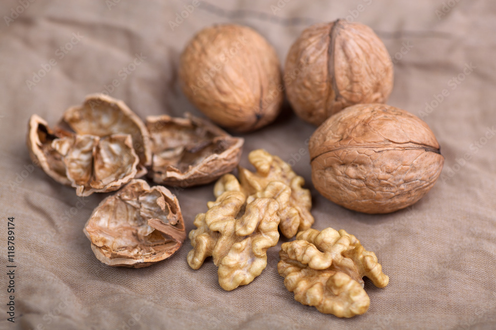 Walnut without shell close-up, and nuts in the shell Walnut without shell close-up, and nuts in the shell