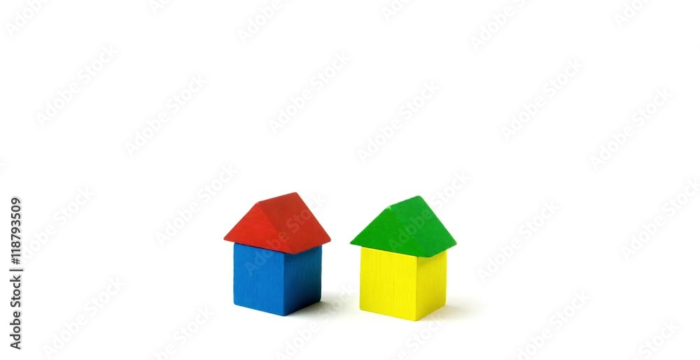 Side view time lapse of building houses of color wooden cubes. All is isolated on the white background. Side view time lapse of building houses of color wooden cubes. All is isolated on the white background.