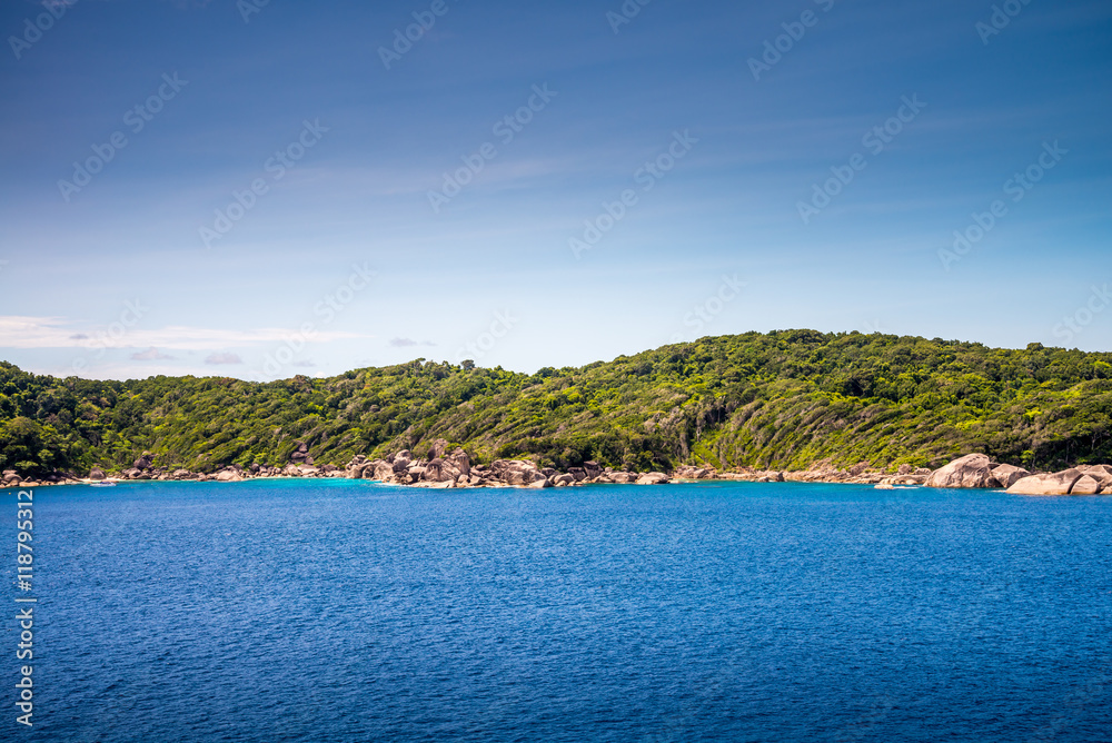 Beautiful tropical Similan island in sunny day blue sky background - Travel summer beach holiday concept.