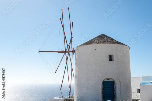 Windmill over the beautiful sea of Santorini